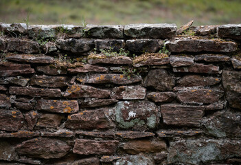 old dry stone wall with lichen