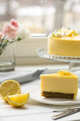 Dessert - Lemon mouse  Cheesecake. A slice of citrus cake with lemon and orange. half a lemon cake. cutaway lemon cake. sponge cake