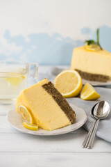 Dessert - Lemon mouse  Cheesecake. A slice of citrus cake with lemon and orange. half a lemon cake. cutaway lemon cake. sponge cake