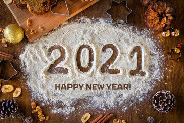 Creative Happy New Year 2021 greeting card for home baker, baking, numbers made out of flour, top...