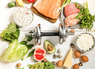 Healthy fresh foods high in protein for athletes, bodybuilders. Top view of the diet food...