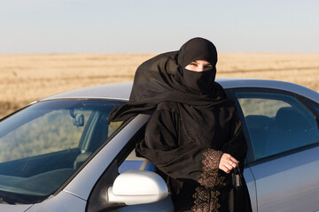 Woman driver in Islamic state. Women's rights and responsibilities.