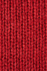 Fototapeta na wymiar Red knitted wool texture background