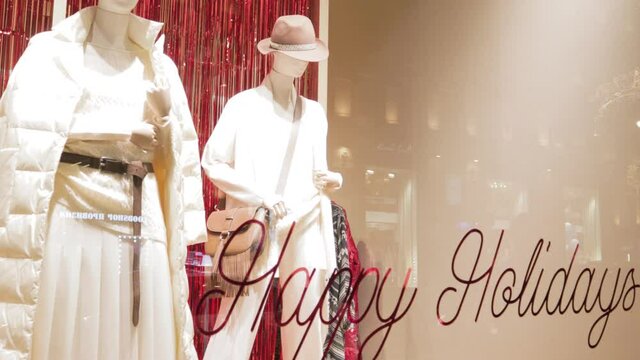 Clothing store window female winter season fashion holidays style
