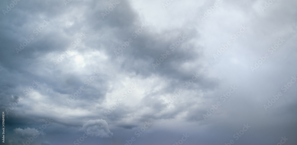 Wall mural clouds in the overcast sky view. climate, environment and weather concept sky background.