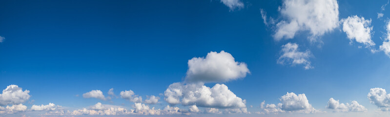 Blue sky with clouds, wide cloudscape background panorama