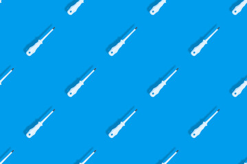 Metal screwdriver with rubber pads.Screwdriver seamless pattern.