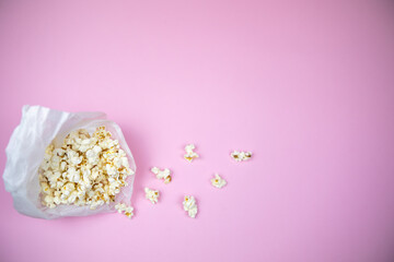 one bucket with popcorn on the pink background