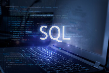 SQL inscription against laptop and code background. Learn sql programming language, computer...
