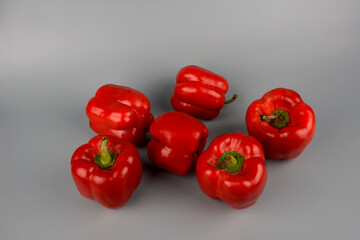 red bell pepper on gray background, food preparation process, proper nutrition