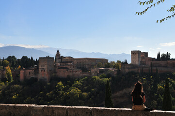 Alhambra palace, snow covered peaks of the Sierra Nevada in bright sunlight during Covid-19-autumn 2020