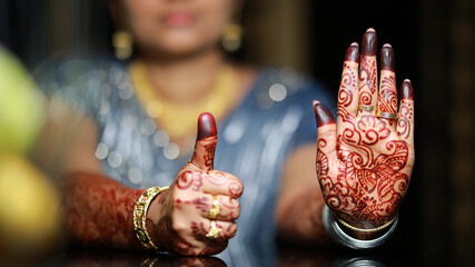 The bride's henna is beautiful and unique engraved on the bride's hand