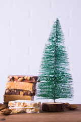 Almond nougat typical Christmas dessert with Christmas decorations