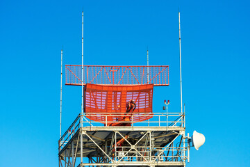 Airport surveillance radar. The curving lower reflector and antenna on top. ASR is a radar system used at airports to detect and display the presence and position of aircraft.