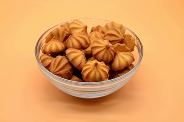 cookies in a transparent cup on a beige background