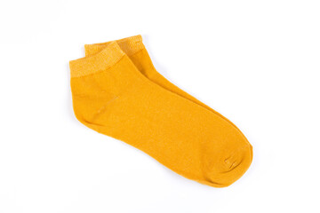 a pair of yellow short socks on a white background, top view