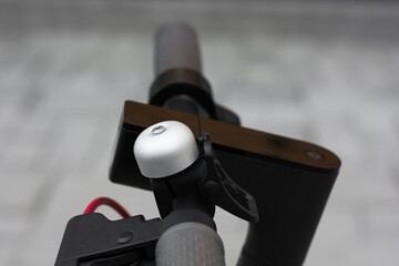 Electric scooter wheel. Showing the bell. side view. Selective focus. Shallow depth of field.  © Marko