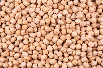 Food background from a texture of raw chickpeas close-up