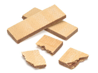 Two biscuit waffles and three pieces of waffles on a white background