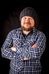 Solid bearded man in a wool cap portrait