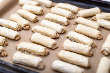 Raw dough products on a baking sheet.