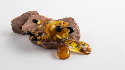 Beautiful yellow vintage Baltic amber brooch in the form of a flower on the natural pink stone....