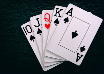 Royal flash without a single card on a black table.