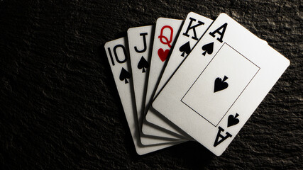 Royal flash without a single card on a black table.