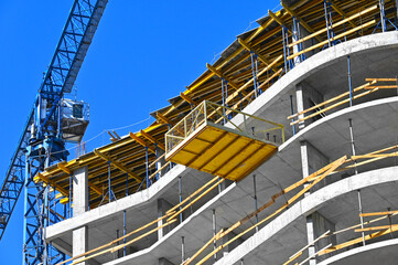 Crane and highrise construction site