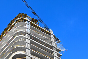 Crane and highrise construction site