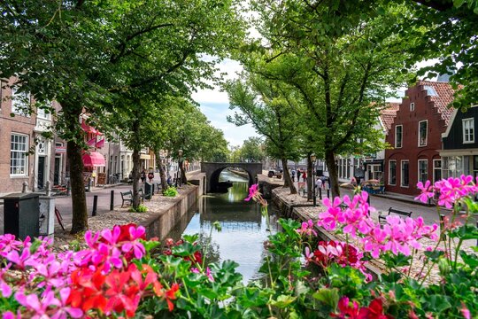 View of Edam from a colorful and flowery bridge