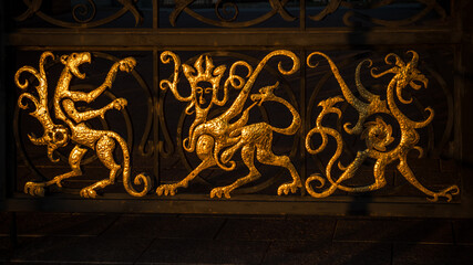 gold signs on the gate