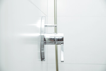 Water tap, turning on the shower. Sanitary, cleanliness and personal hygiene concept.