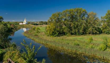 Obraz na płótnie Canvas landscape with river, church and sky
