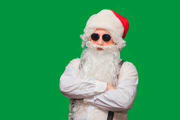 Portrait of stylish Santa Claus on color background.