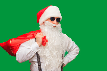 Fototapeta na wymiar Portrait of stylish Santa Claus on color background.