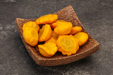Marinated yellow patisson in the bowl