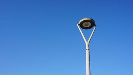 street lamp against blue sky background