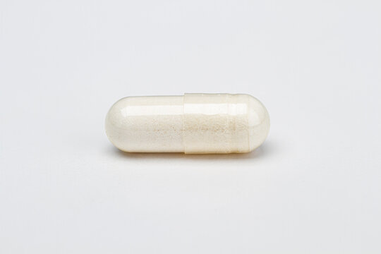 Pill filled with white ingredient