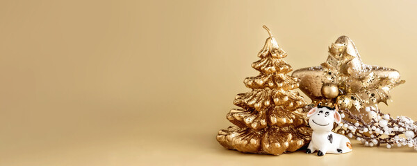 Bull symbol of the new year 2021. Ceramic small figurine of cute white bull, golden christmas fir...