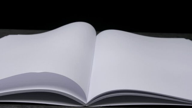 Blank magazine with turning pages, closeup