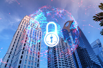 Padlock icon hologram on low, wide angle view of glass and steel contemporary skyscrapers in financial downtown. The concept of success in cyber security intelligence. Multi exposure.