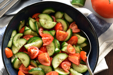 Cucumber and tomato salad.  Healthy and dietary food.  Weight loss program meal. 