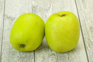 Two ripe green sweet apples