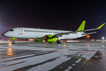 Modern passenger airplane on the night airport apron