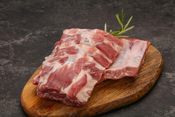Raw pork ribs served rosemary