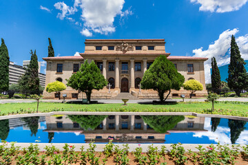 Fototapeta na wymiar The Supreme Court of Appeal with reflection in the pond in free state Bloemfontein South Africa