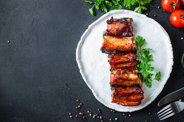 grilled ribs BBQ pork in spices and tomato sauce piece of meat second course snack ready to eat on the table healthy meal snack ingredient top view copy space for text food background rustic
