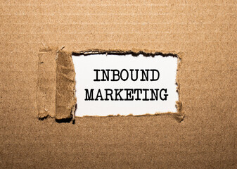 The text INBOUND MARKETING. behind torn brown paper