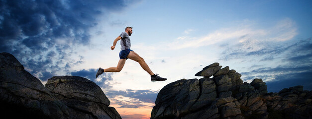 banner of man jumping between cliffs success concept